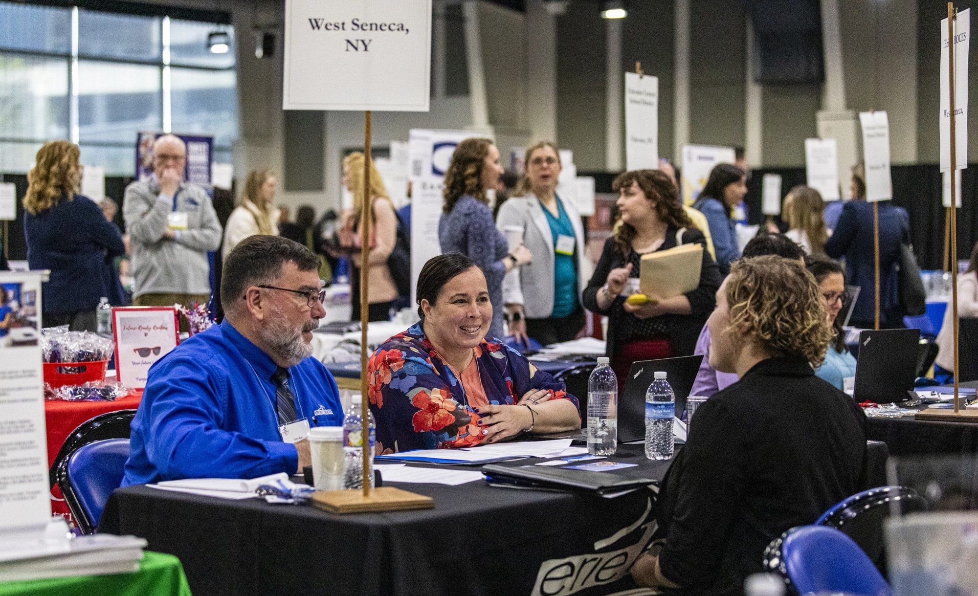 Two recruiters interview candidate at the Western NY TRD.